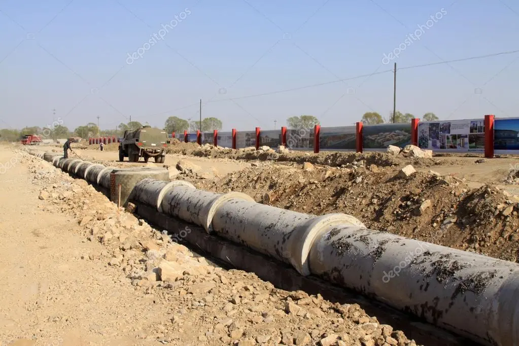 Storm water drainage pipe being laid in a trench